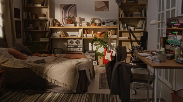 Empty creative bedroom and home music studio showing music production equipment during camera pan. Footage suitable for remote work, freelance lifestyle, and music creation advertisements