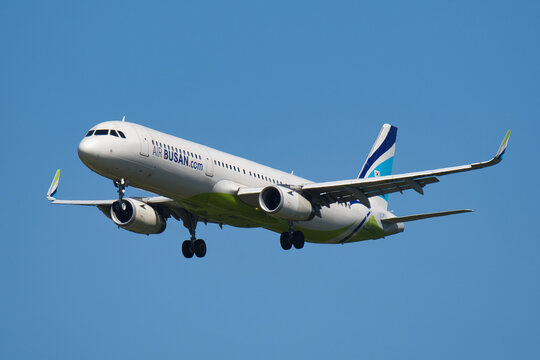 Air Busan Airbus A321-200 (HL8039) on final approach to Narita International Airport under clear blue sky