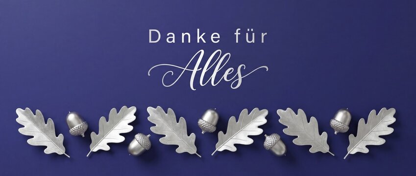 Danke f&uuml;r Alles German thank you banner featuring metallic silver oak leaves and acorns over dark blue background, elegant horizontal layout for autumn appreciation and gratitude messages.