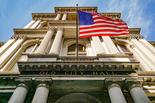 Old City Hall building with an American flag flying in Boston, Massachusetts