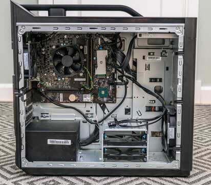 Gothenburg, Sweden - May 24 2026: Open desktop computer case showing motherboard cooling fan and cables.