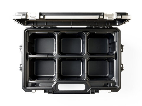 Empty heavy duty black plastic tool box with compartments and open lid viewed from above isolated on clean white background studio shot closeup