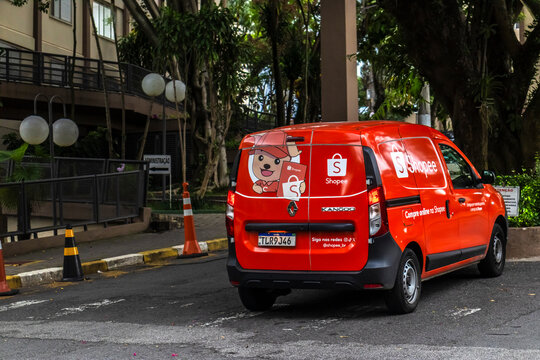 Sao Paulo, SP, Brazil, January 29, 2026. A red Renault Kangoo delivery van branded with the Shopee logo parked on a city street, used for e-commerce shipping and logistics services.