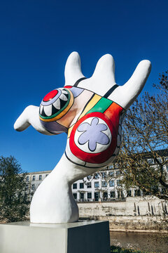 Hanover, Germany - April 21, 2026: Close-up views of one of the iconic Nanas sculptures by Niki de Saint Phalle displayed along the Leine River in Hanover, Germany