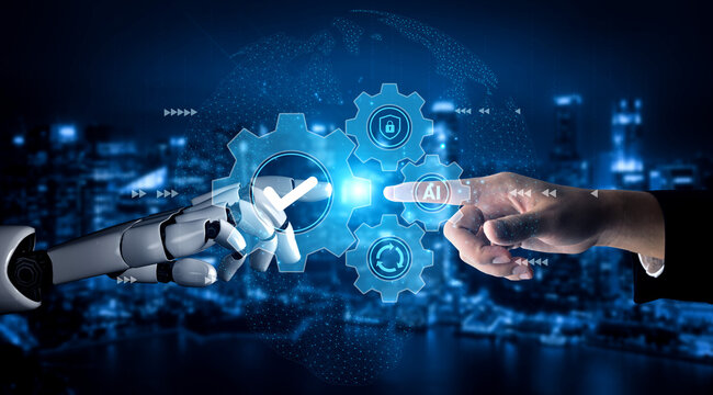 This image illustrates the dynamic interaction between a human hand and a robotic hand, symbolizing the synergy of technology and human creativity in the digital age. Gantry