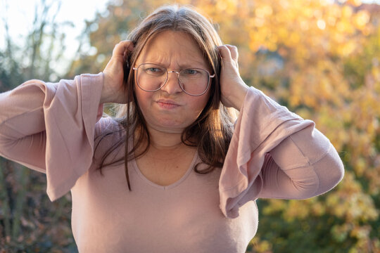 upset mature woman looking sad and resentful outdoors, middle aged female experiencing emotional distress, grief, disappointment, loneliness, midlife crisis, mental health struggles in adulthood