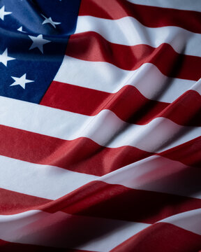 Patriotic waving american flag with stars and stripes closeup