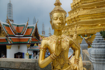 BANGKOK, THAILAND, 5 October 2025 – A golden statue of a mythical creature stands guard at the Grand Palace, a historic complex of buildings in Bangkok, Thailand. © Zenstratus