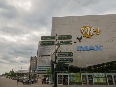 Amsterdam / Netherlands - June 2016: Direction signs and Pathe Arena.