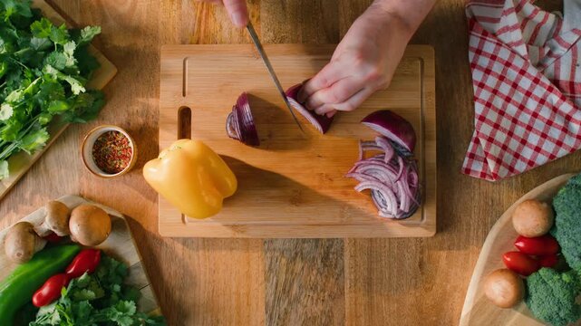 Man cut red onion, Chef hands with knife for onion, cutting and preparation with cooking for dish. Restaurant, culinary service and cook with skills for catering, business and hospitality by closeup