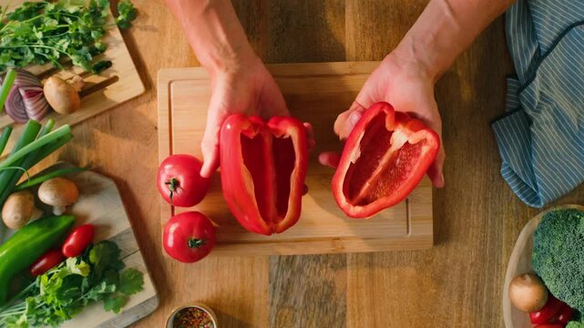 Man cut red sweet pepper, Chef hands with knife for onion, cutting and preparation with cooking for dish. Restaurant, culinary service and cook with skills for catering, business and hospitality by