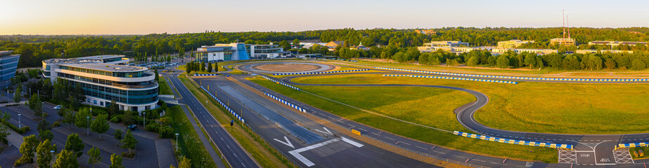 Fototapeta premium Aerial panorama of Brooklands racing track at dusk in Surrey, England, UK