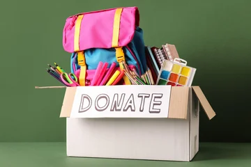 Fototapeten Musik Box of school supplies for donation with backpack and art materials  © Pixel-Shot