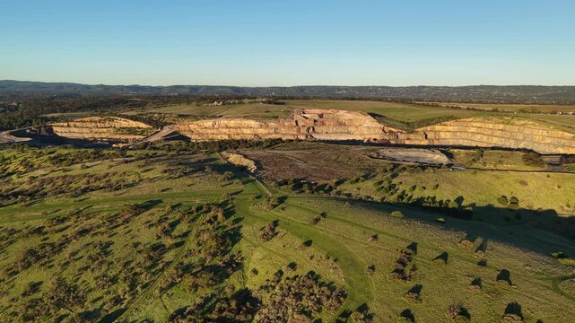 Marino, Adelaide, South Australia &ndash; 4K aerial drone footage of Linwood Quarry, limestone extraction, hard rock aggregates, terraced quarry walls, mining operation between Seacliff Park, Hallett Cove