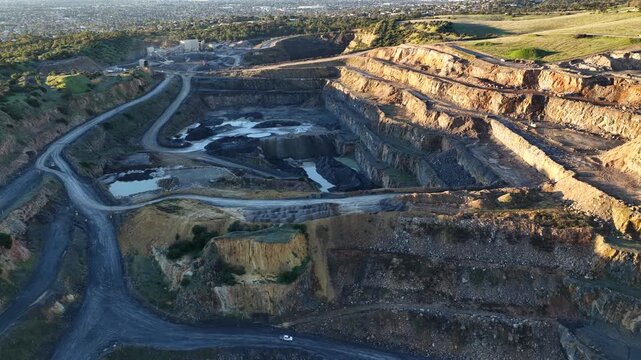 Marino, Adelaide, South Australia &ndash; 4K aerial drone footage of Linwood Quarry, limestone extraction, hard rock aggregates, terraced quarry walls, mining operation between Seacliff Park, Hallett Cove