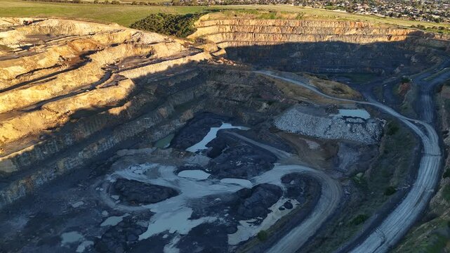 Marino, Adelaide, South Australia &ndash; 4K aerial drone footage of Linwood Quarry, limestone extraction, hard rock aggregates, terraced quarry walls, mining operation between Seacliff Park, Hallett Cove