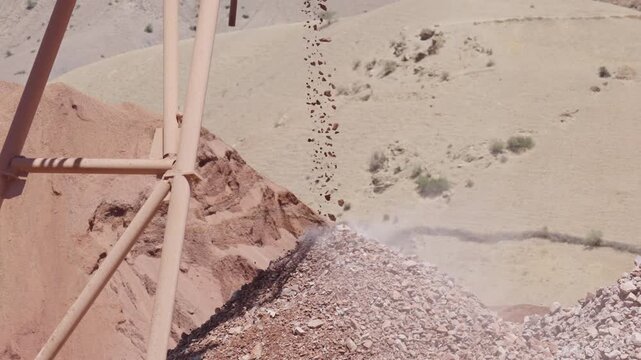 Crushed Rocks Falling From a Conveyor Onto an Aggregate Quarry Stockpile