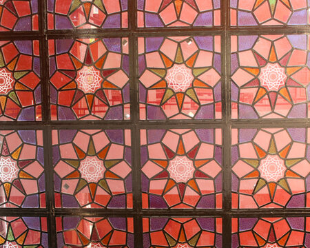 Part of a stained-glass window featuring decagrams ten-pointed stars symbolizing the divine, the balance between spirit and matter, and wholeness in Curitiba, Paran&aacute;, Brazil.
