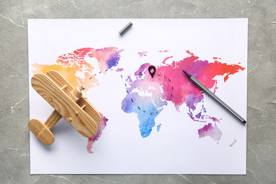 World map with route and wooden plane on grunge background. Itinerary concept