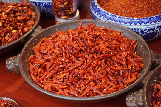 A taste of Guizhou. Bold and spicy local chili dishes at the historic Qingyan Ancient Town market, China.