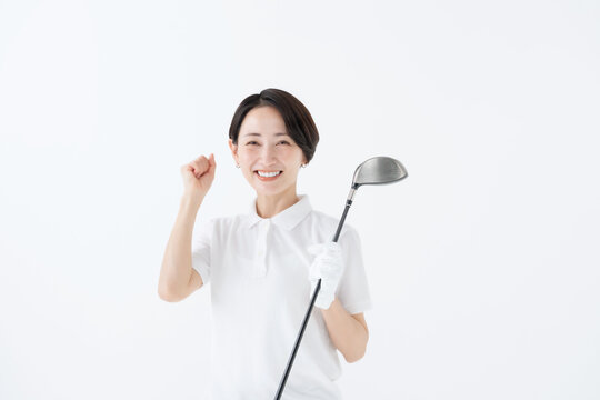 ガッツポーズをする女性　ゴルフ　白バック