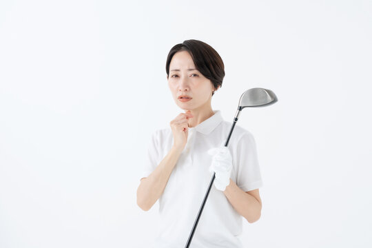 悩む女性　ゴルフ　白バック