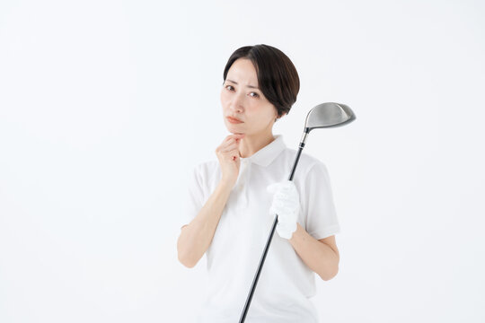 悩む女性　ゴルフ　白バック