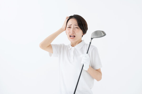 悩む女性　ゴルフ　白バック