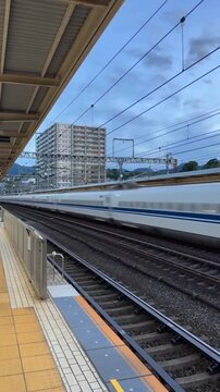 Doctor Yellow Shinkansen Inspection Train With Passing Bullet Train In Japan