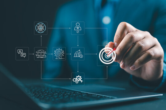 Businessman using stylus and laptop with virtual AI workflow process icons showing automation steps data analysis user verification and target objective in modern digital workspace