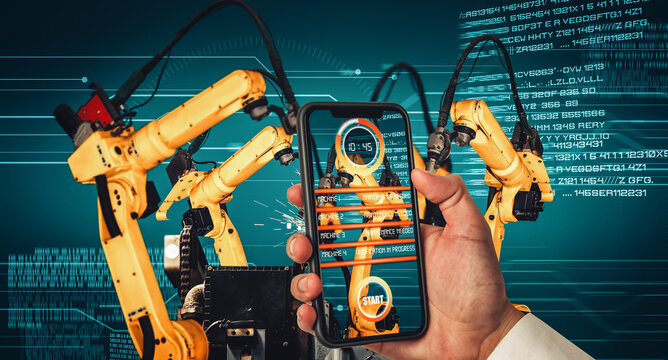 Engineer controls robotic arms by augmented reality industry technology application software. Smart robot machine in future factory working in concept of Industry 4.0 or 4th industrial revolution.