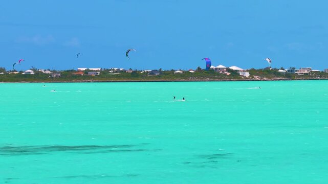 A 4k drone clip of a busy day of kitesurfing in at Long Bay Beach