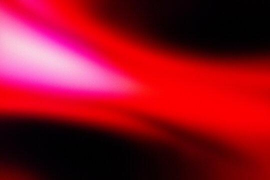 Vibrant red glow pulses across dark background. Soft gradients blend pink, orange, and deep red hues. Abstract form suggests motion or energy flow. Ideal for digital art, futuristic themes