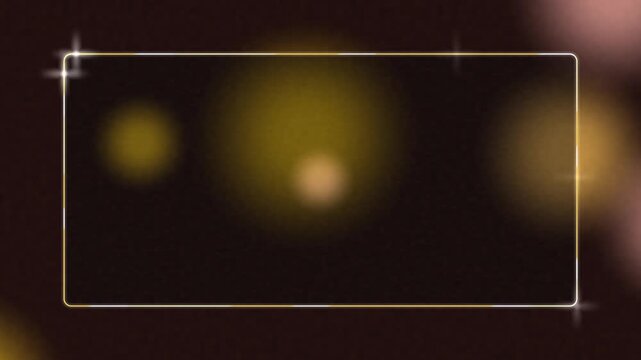 Glowing golden rectangle frame with sparkling light effects creates a dynamic motion video animation sequence