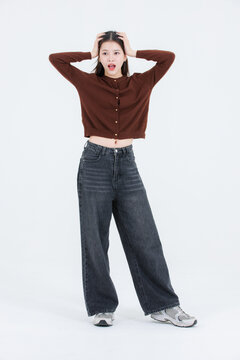 Full body portrait beautiful asian happy smile cute young teenage woman long black hair wearing casual clothes posing confidently look at camera isolated on white background studio lifestyle concept.