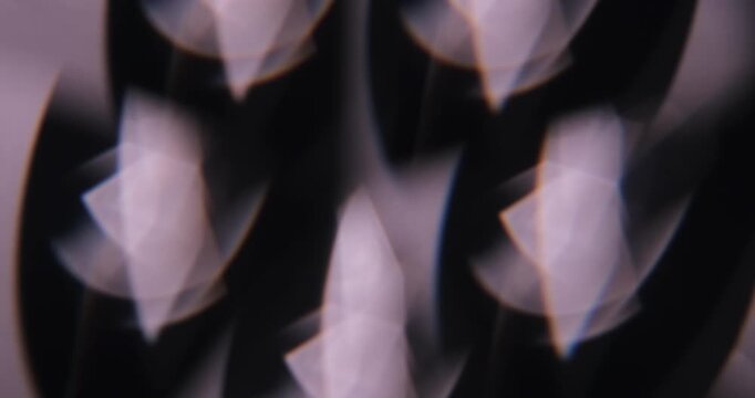 Defocused abstract flare. Glare art. Blur dark black purple illuminated glint lens flicker leaking on dazzle optical creative background.