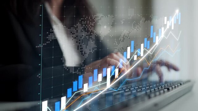 A business professional engages with digital financial charts and stock market data on a computer screen, highlighting trends and insights for informed decision-making. Copula