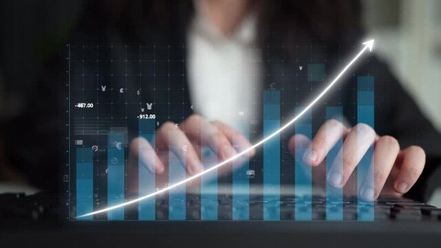 A business professional engages in data analysis on a keyboard, surrounded by a digital graph illustrating growth. The workspace conveys innovation and productivity. Copula