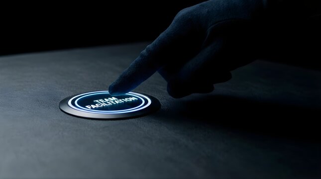 Finger pressing glowing team facilitation button to initiate business collaboration