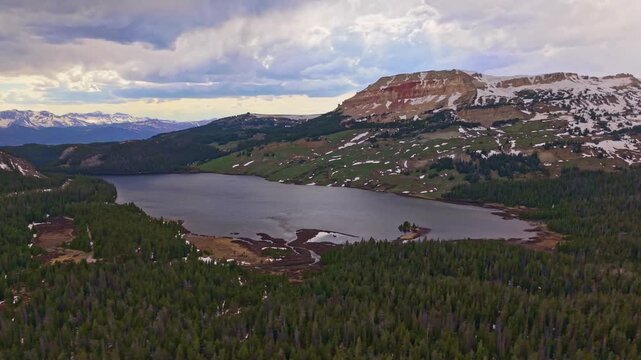 Scenic aerial view of Beartooth Lake with a rugged mountain range in the foreground in Wyoming
