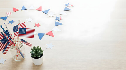Obraz premium Festive American flags and decorations arranged on a wooden surface, perfect for celebrating holidays and events with patriotic flair