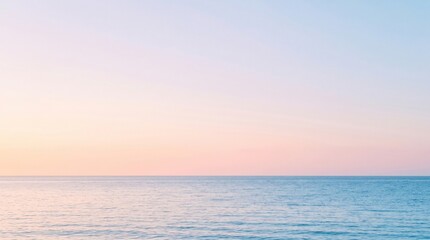 Obraz premium Serene Ocean Horizon at Sunset with Soft Pastel Sky Reflection