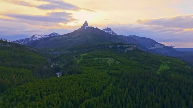Scenic aerial view of the Beartooth Mountains illuminated by a dramatic sunset sky