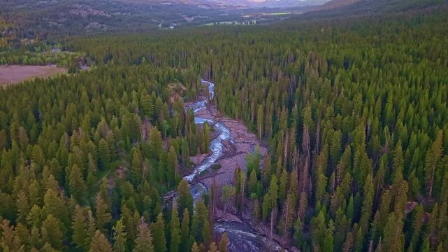 Scenic aerial view of a creek running through the Beartooth Mountains at sunset in Wyoming