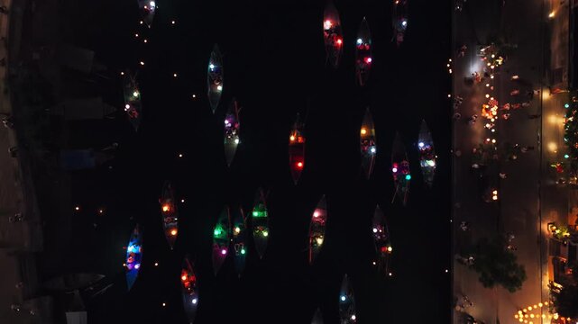 Colorful Lights On Boat Sailing Through Hoai River At Night In Hoi An, Vietnam. - aerial shot