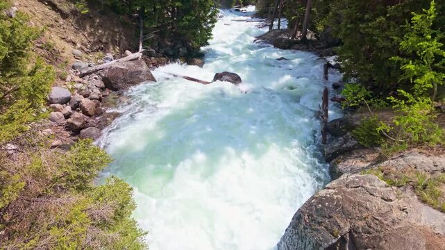 Scenic view of Lake Creek flowing through the mountains beside Beartooth Highway in Wyoming