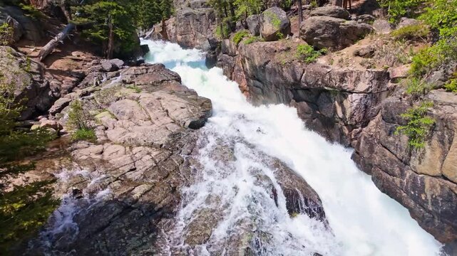 Lake Creek mountain river flows harshly through rocky terrain along the Beartooth Highway in Wyoming