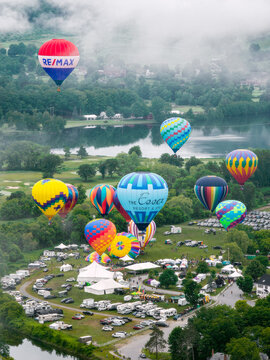 Hot air balloons taking off in the town commons area of Quechee Village in Vermont at the 46th Quechee Hot Air Balloon Festival. Aerial photo taken June 21, 2026 in Quechee, VT.