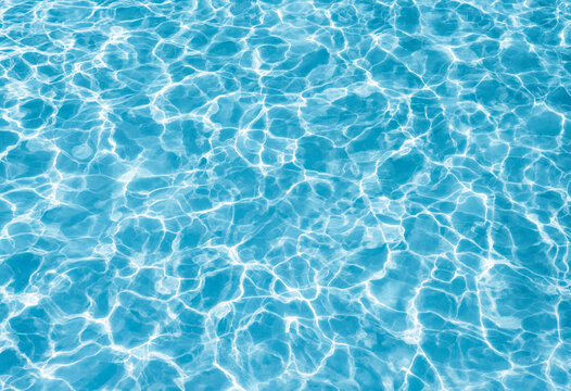 Shimmering blue water surface with sunlight reflections and ripples swimming pool light blue crystal clear sunny day reflection sunlight background transparent glistening vacation abstract