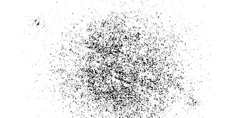A scattered collection of dark, granular particles on a white backdrop creates a visually striking abstract pattern. © MdKefaitUllah